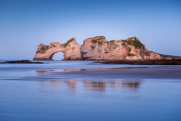 Dusk over Archway Islands on Wharariki Beach